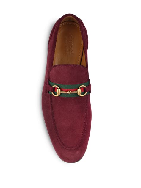 red suede gucci loafers.